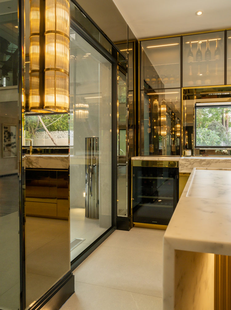 Fontana Moor Park home bar detail of the Italian luxury design touches such as the polished gold cabinetry | Design as Art